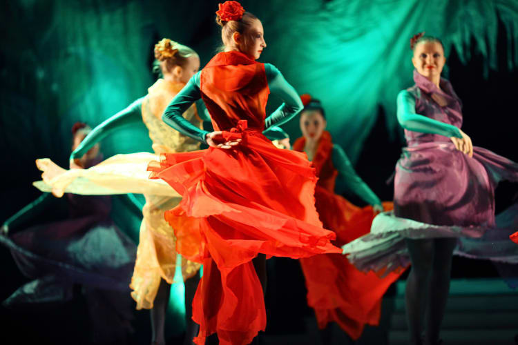 Women dancing during a musical theatre performance