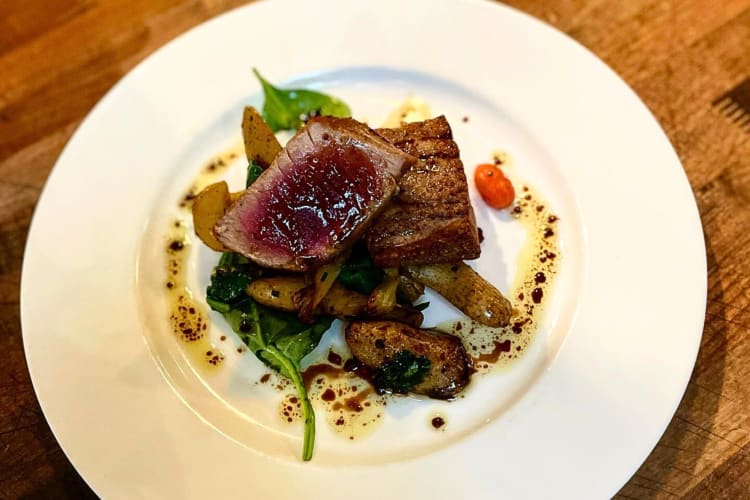 Steak on top of leafy greens and potatoes, from Café La Haye, a Sonoma restaurant