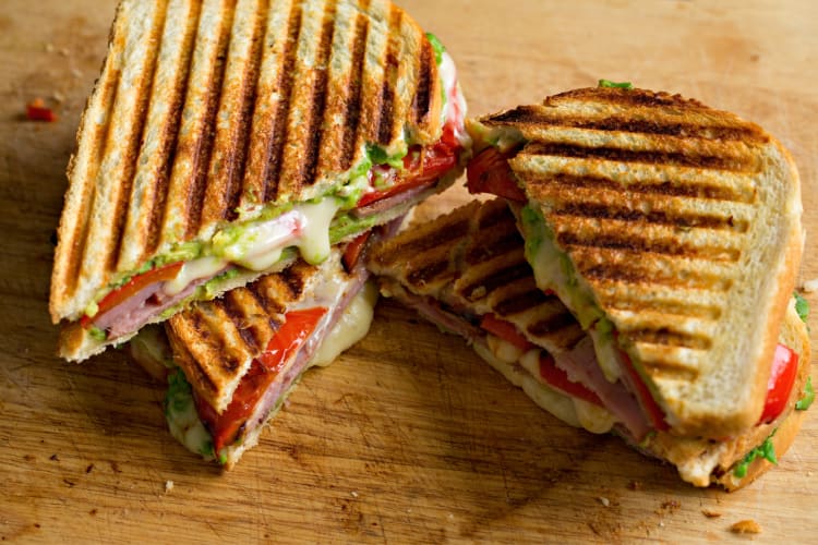 Four slices of a roasted vegetable panini as part of the best breakfast in Orange County