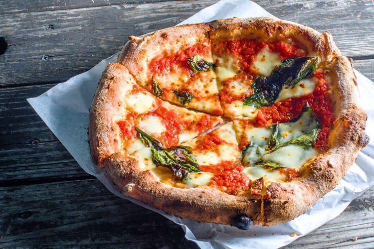 Margharita pizza on parchment paper