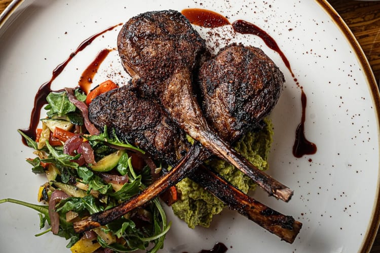 Aerial view of lamb chops from Campagnia Bistro, a restaurant in Fresno