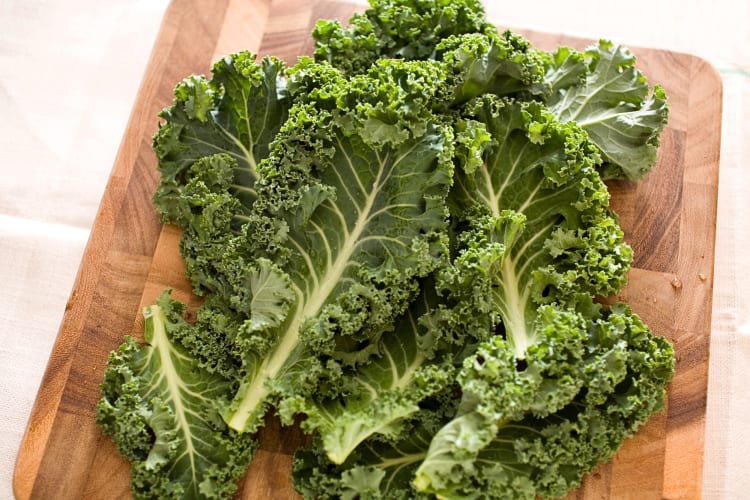 Kale leaves on a chopping board