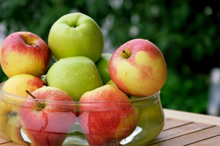 Whole apples in a glass bowl