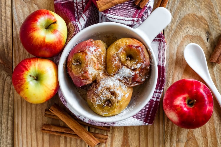 Baked apples on a wooden surface