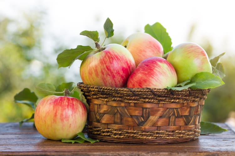 Fresh apples in a basket 
