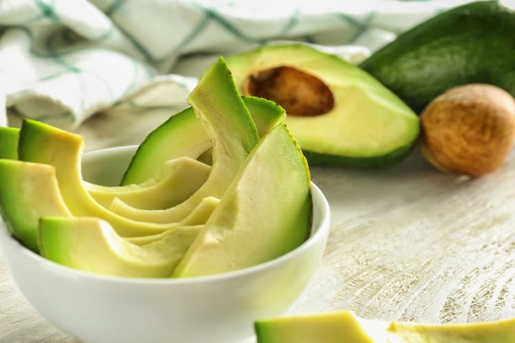 A bowl of avocado slices 