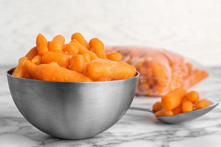 Frozen baby carrots in a bowl