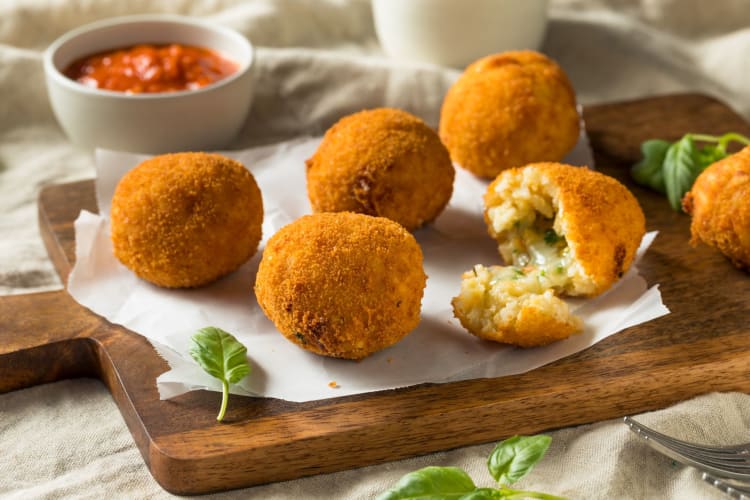 Arancini rice balls with a tomato dip.
