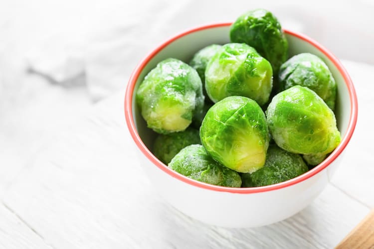 Frozen Brussels sprouts in a small bowl