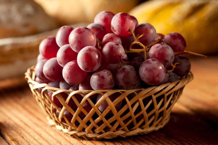 A basket with red grapes