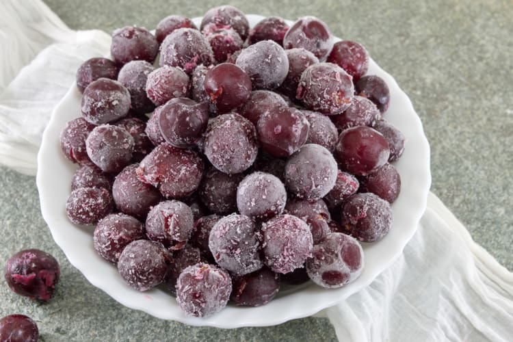 Frozen red grapes on a plate