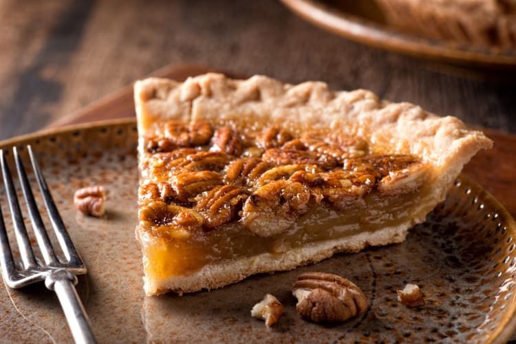 A slice of pecan pie on a plate