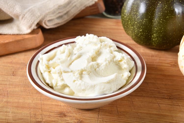 Creamy ricotta cheese mixture in a white bowl