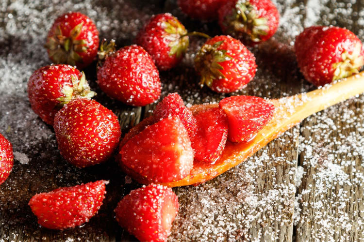 You can freeze strawberries with sugar for later use in baking