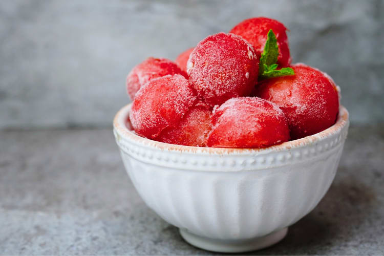 Frozen watermelon balls in bowls