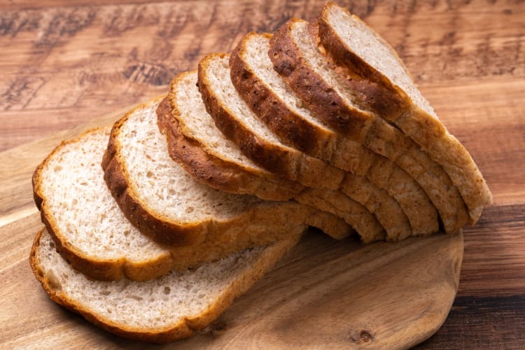 Slices of bread on a wooden board.