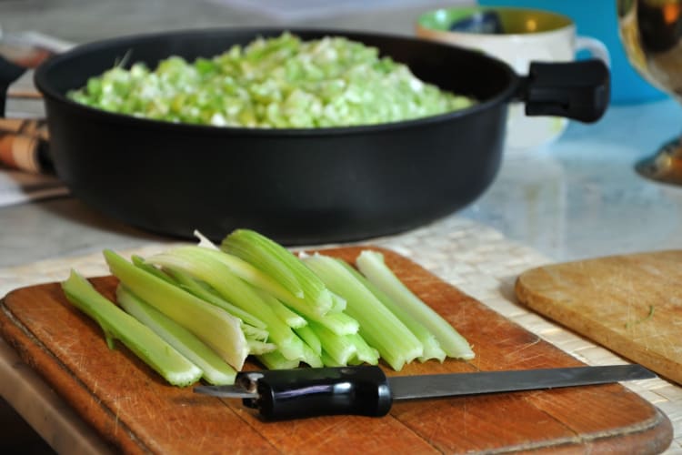 Celery stalks with leaves removed, ready to be chopped.