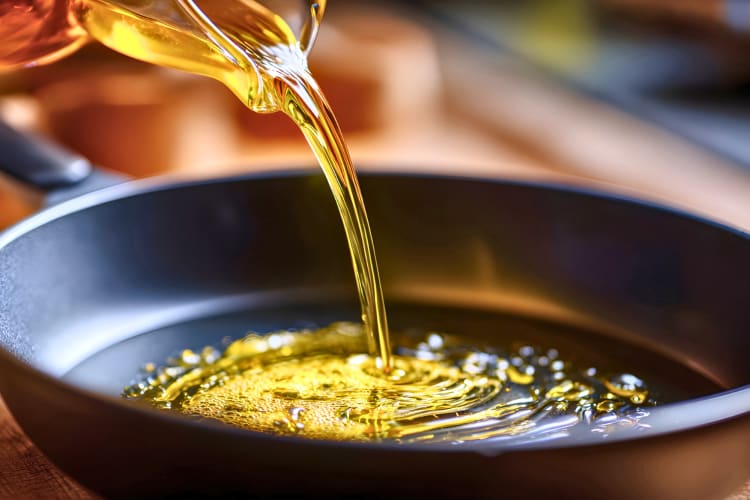 Canola Oil being poured into a pan