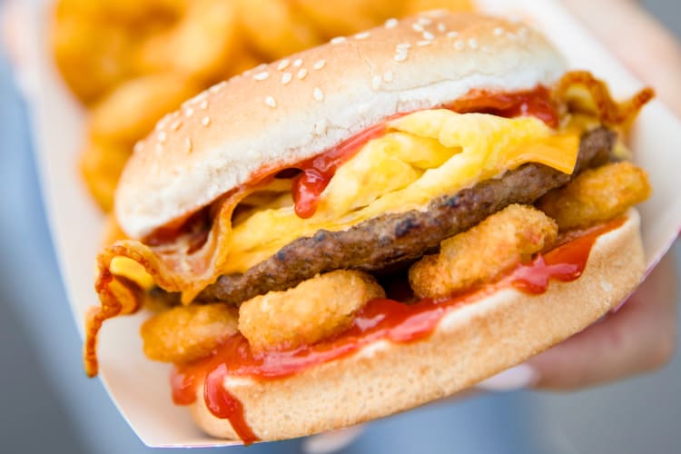 You can order from the Carl's Jr. breakfast menu at 6 a.m.