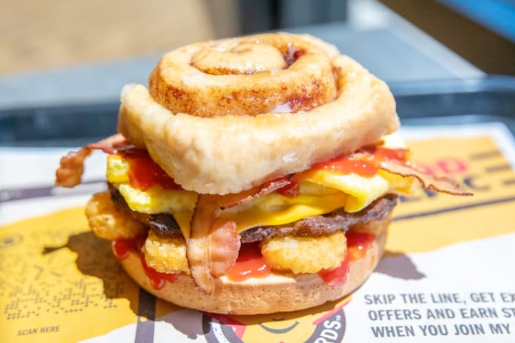 A cinnamon roll breakfast sandwich