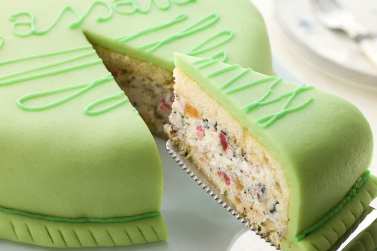 One slice being lifted from a whole cassata