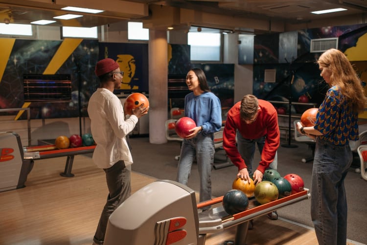Bowling is one of the fun and laid-back date ideas in Charlotte