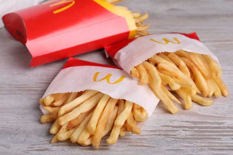 McDonald's fries on a white wood surface