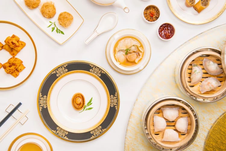 A selection of dim sum dishes on a table