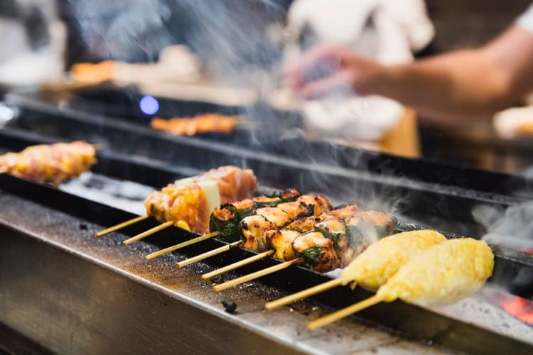 Meat being grilled at a restaurant in Hong Kong.