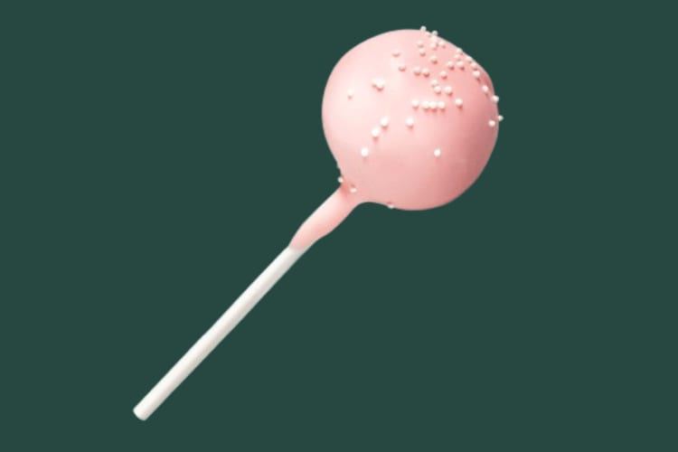 A pink cake pop with white sprinkles
