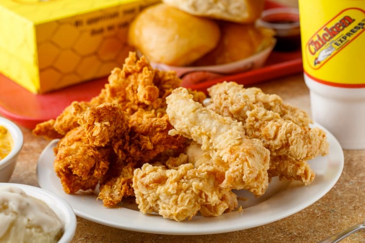 A plate of plain and spicy chicken tenders from Chicken Express