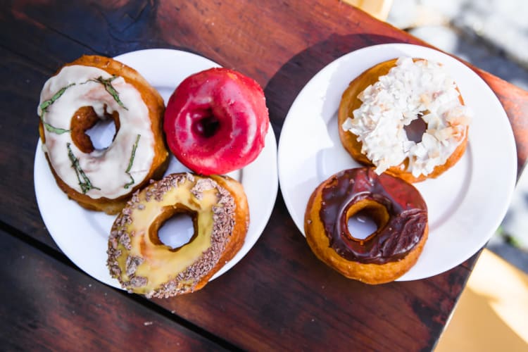 Five different types of donuts on two plates