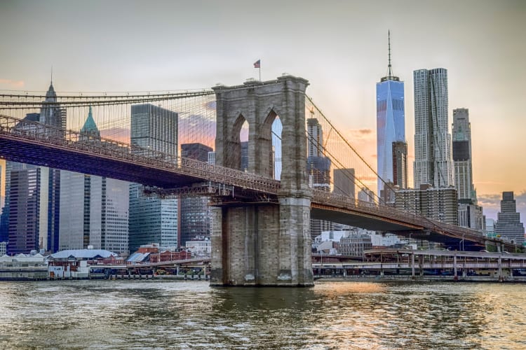 The Brooklyn Bridge next to the Manhattan skyline