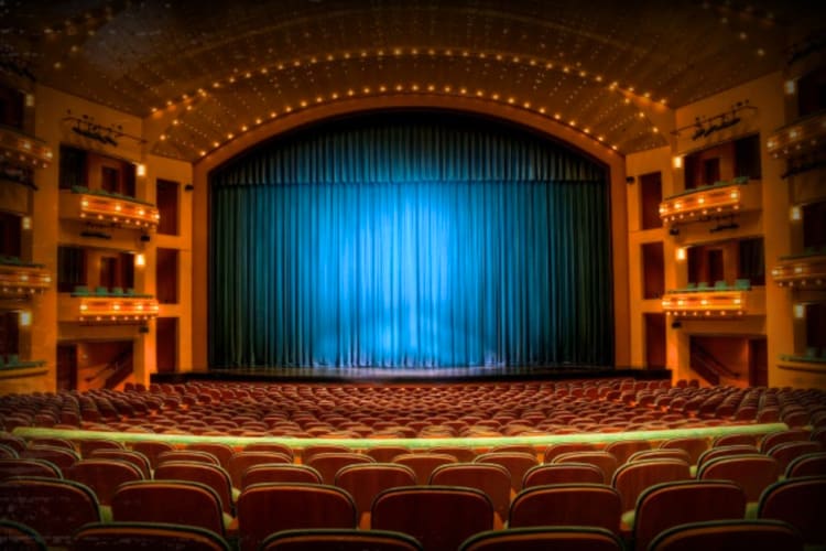 A theater with the curtain drawn