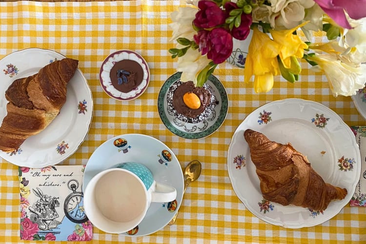 Aerial view of two croissants, cupcakes and a warm drink from Cioccolateria Lorenzo