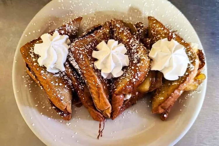 Aerial view of French toast with whipped cream, from Clary's Café, a Savannah restaurant