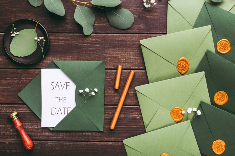 Green invitations on a table