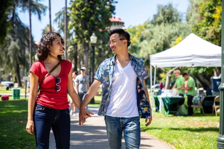 Couple strolling through a park during a date idea in OKC