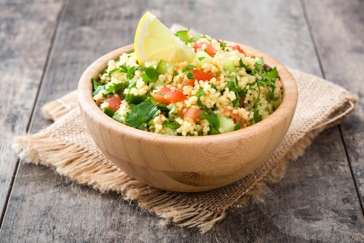 Couscous salad in a wooden bowl