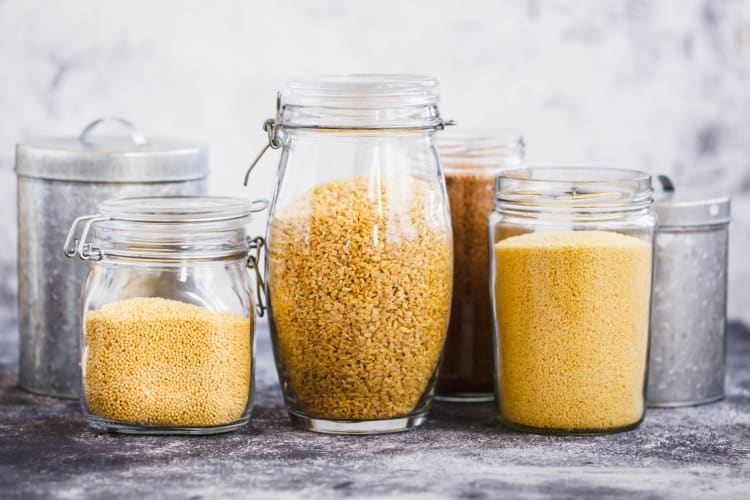 Glass jars with rice and couscous