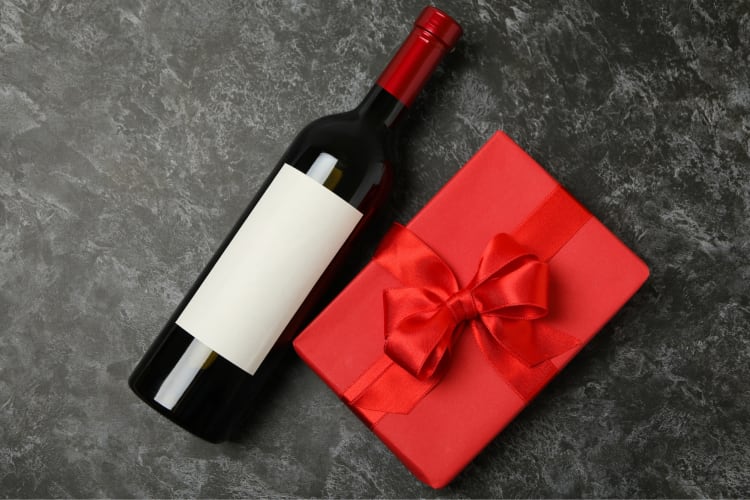 For a great gift card presentation idea, attach it to a bottle of something they love