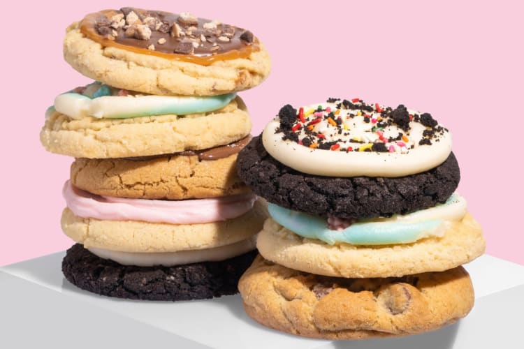 A selection of cookies next to a pink background