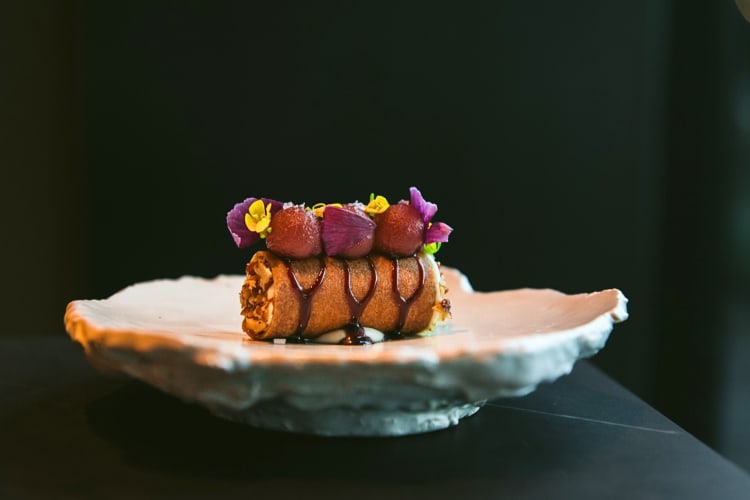 Eye-level view of a gourmet dish from Cyrus, an eatery nearby to Sonoma restaurants