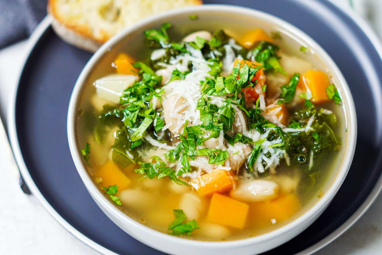 white bean and kale soup is filled with buttery beans and hearty vegetables