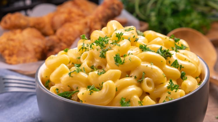 one pot mac and cheese is covered in buttery, gooey cheese