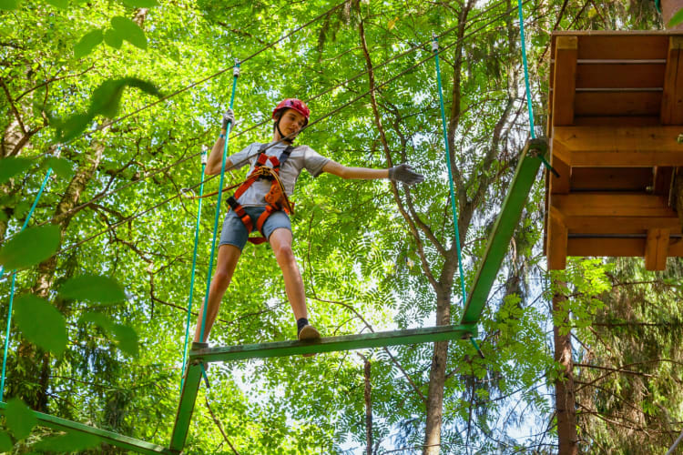 Going to a treetop adventure is one of the outdoor things to do in Dallas with family
