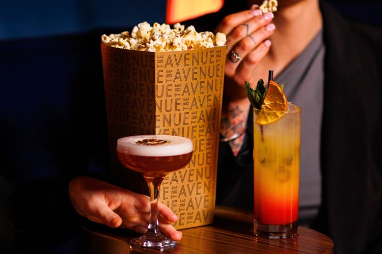 Cocktails and popcorn on a small table