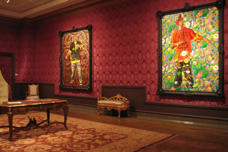 Artworks and vintage furniture in a museum exhibit