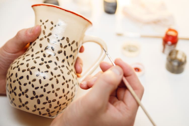 Pottery painting is the perfect date idea in Columbus, Ohio for creative couples