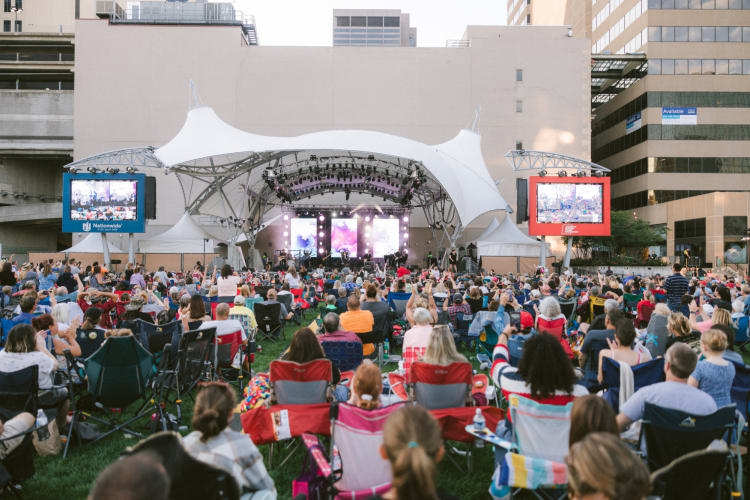 People watching an outdoor concert